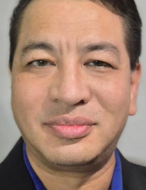 Close-up of a man's face with a neutral expression.